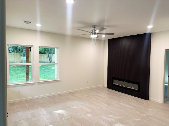 2227 Stoneman St, Dallas, TX 75215 - unfurnished room with ceiling fan, baseboards, and recessed lighting