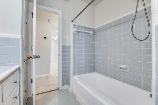 2645 Woodmere Dr, Dallas, TX 75233 - full bathroom with tile patterned flooring, tile walls, bathing tub / shower combination, and vanity