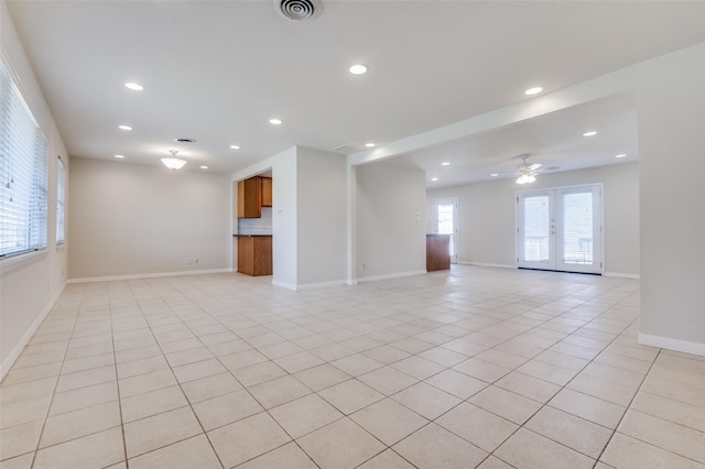 2645 Woodmere Dr, Dallas, TX 75233 - unfurnished living room featuring visible vents, light tile patterned floors, recessed lighting, and baseboards