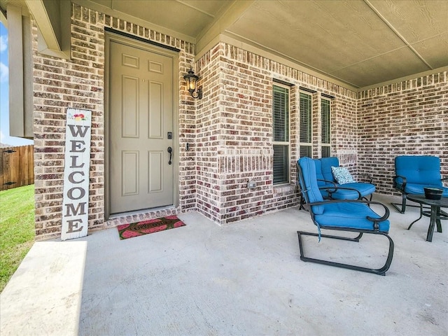 entrance to property with brick siding