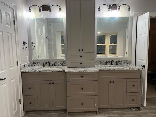 104 Greenbriar Ln, Colleyville, TX 76034 - bathroom featuring wood finish floors and double vanity