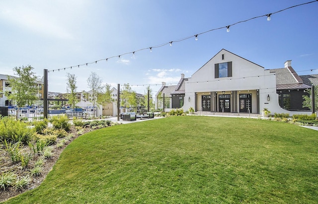 4036 Wellesley Ave, Frisco, TX 75034 - rear view of house featuring stucco siding, a residential view, metal roof, and a patio