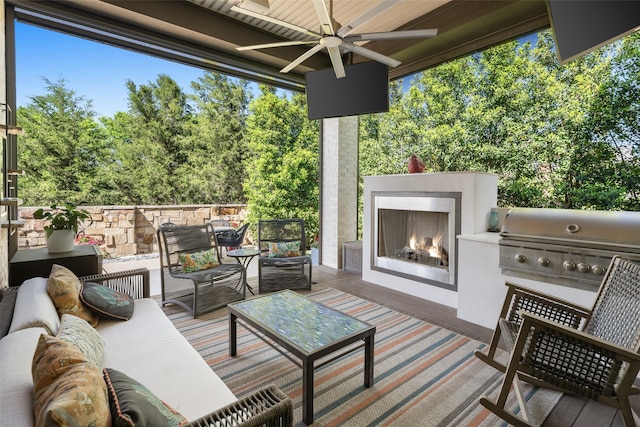 4029 Campania Ct, Colleyville, TX 76034 - view of patio / terrace featuring an outdoor living space with a fireplace, a ceiling fan, view of wooded area, and exterior kitchen