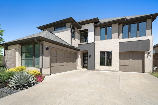 4029 Campania Ct, Colleyville, TX 76034 - view of front of home with driveway, stucco siding, a balcony, a garage, and brick siding