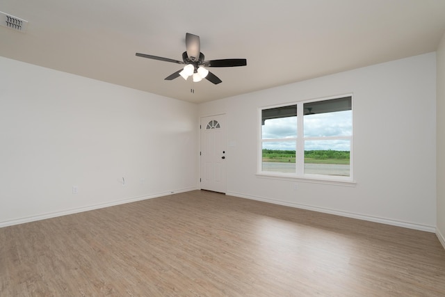 5557 N 10th, Abilene, TX 79601 - unfurnished room featuring wood finished floors, ceiling fan, and baseboards