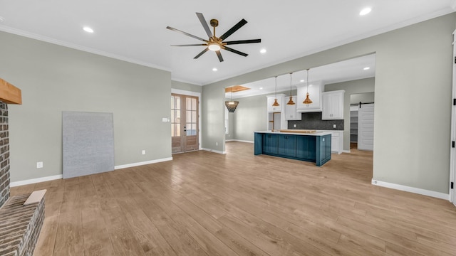 JarTBD Leo Lane, Poolville, TX 76487 - unfurnished living room featuring light wood-style flooring, a brick fireplace, ceiling fan, and crown molding