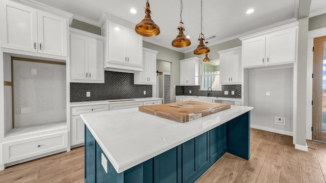 JarTBD Leo Lane, Poolville, TX 76487 - kitchen featuring a kitchen island, white cabinetry, stovetop, and ornamental molding