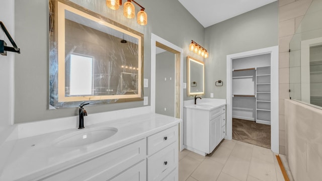 JarTBD Leo Lane, Poolville, TX 76487 - full bath featuring tile patterned flooring, a walk in closet, two vanities, and a sink