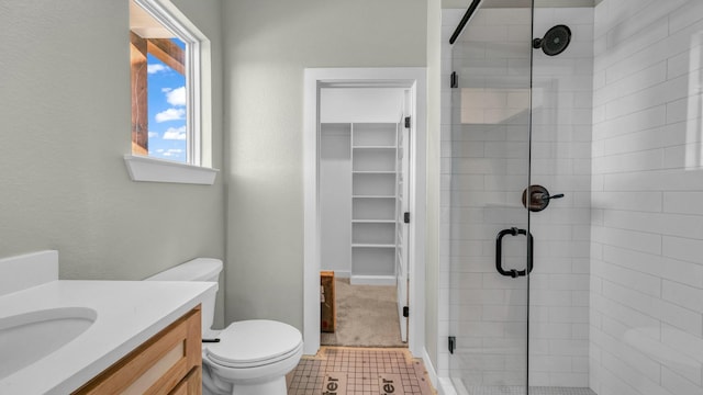 JarTBD Leo Lane, Poolville, TX 76487 - bathroom featuring vanity, a shower stall, a walk in closet, and toilet
