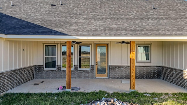 JarTBD Leo Lane, Poolville, TX 76487 - view of exterior entry with a patio, brick siding, and roof with shingles