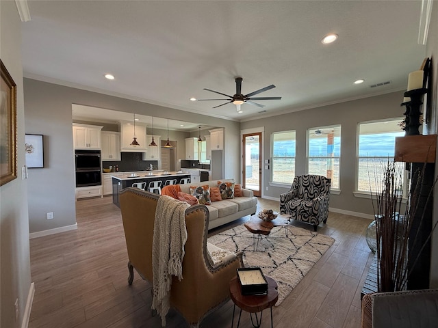JarTBD Leo Lane, Poolville, TX 76487 - living room featuring ornamental molding, a ceiling fan, baseboards, and wood finished floors