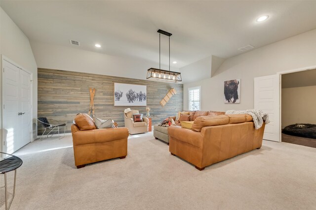 4406 Ravenbank Dr, Rockwall, TX 75087 - carpeted living area with an accent wall, wooden walls, recessed lighting, and visible vents