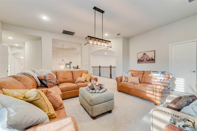 4406 Ravenbank Dr, Rockwall, TX 75087 - living area with recessed lighting, visible vents, arched walkways, and carpet