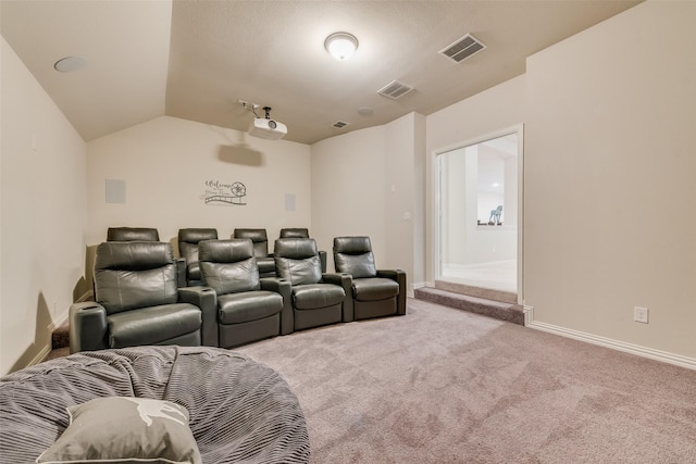 4406 Ravenbank Dr, Rockwall, TX 75087 - carpeted cinema room with visible vents, baseboards, and vaulted ceiling