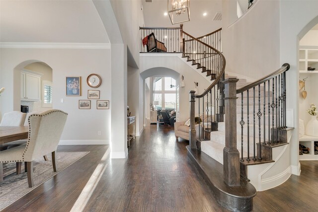 4406 Ravenbank Dr, Rockwall, TX 75087 - entryway with arched walkways, dark wood finished floors, and a wealth of natural light
