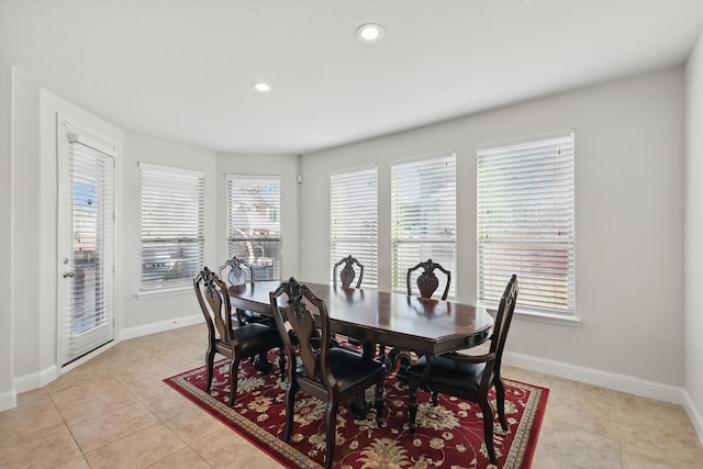 dining space with light tile patterned floors, recessed lighting, and baseboards