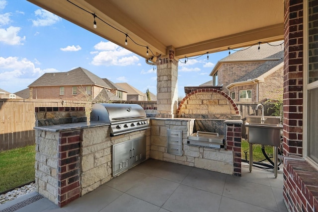 view of patio / terrace featuring grilling area, fence, and area for grilling