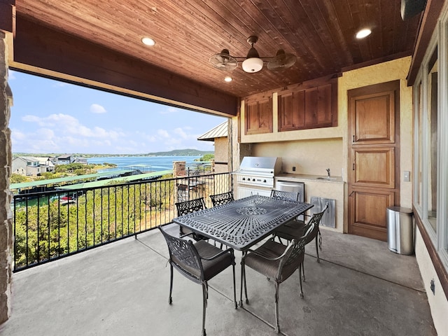 2195 Century Oak Dr, Graford, TX 76449 - view of patio with a balcony, area for grilling, a sink, a water view, and a grill