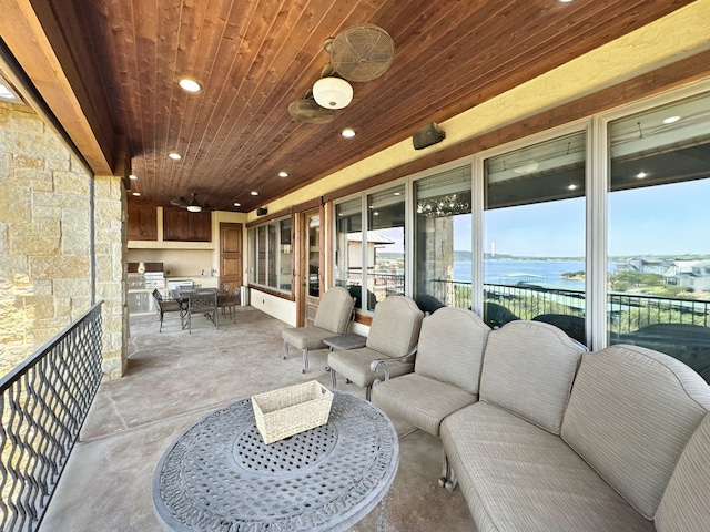 2195 Century Oak Dr, Graford, TX 76449 - view of patio with an outdoor kitchen, a water view, and an outdoor hangout area