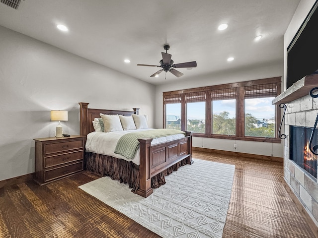 2195 Century Oak Dr, Graford, TX 76449 - bedroom featuring a ceiling fan, baseboards, visible vents, recessed lighting, and a lit fireplace