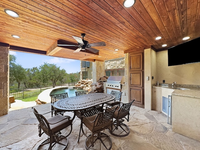 2195 Century Oak Dr, Graford, TX 76449 - view of patio / terrace featuring area for grilling, fence, a grill, outdoor dining area, and ceiling fan
