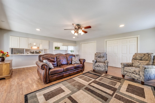 909 Coffield St, Bowie, TX 76230 - living area with a ceiling fan, light wood finished floors, and recessed lighting