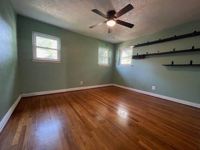 3408 Chaffin Dr, Richland Hills, TX 76118 - unfurnished room featuring a textured ceiling, wood-type flooring, baseboards, and a ceiling fan