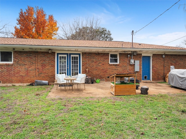 3408 Chaffin Dr, Richland Hills, TX 76118 - rear view of house featuring a patio area, brick siding, and a lawn