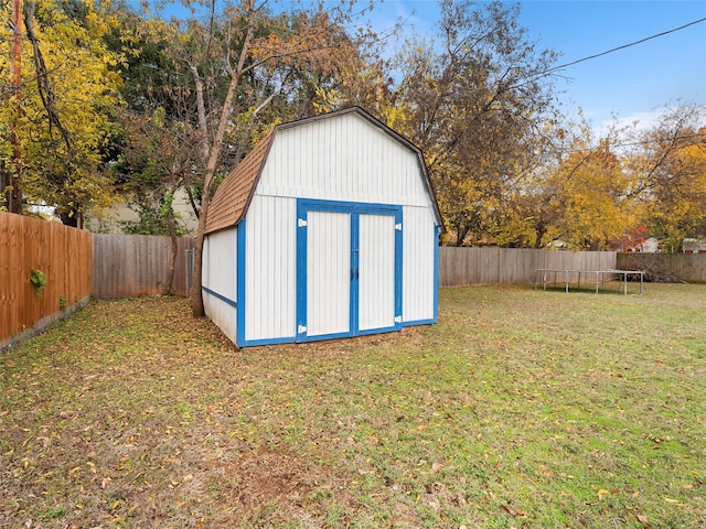 3408 Chaffin Dr, Richland Hills, TX 76118 - view of shed with a fenced backyard and a trampoline