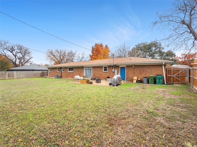 3408 Chaffin Dr, Richland Hills, TX 76118 - back of property featuring a patio, a gate, a fenced backyard, a yard, and brick siding
