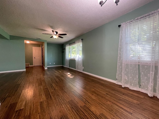 3408 Chaffin Dr, Richland Hills, TX 76118 - unfurnished room featuring a textured ceiling, dark wood-style floors, a ceiling fan, and visible vents