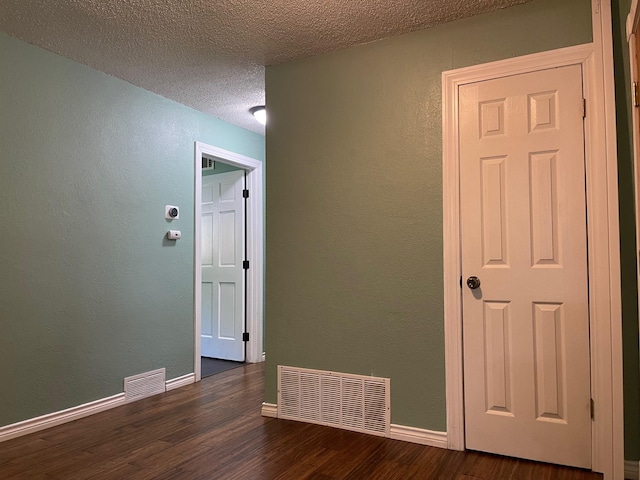 3408 Chaffin Dr, Richland Hills, TX 76118 - interior space featuring baseboards, visible vents, a textured ceiling, and wood finished floors