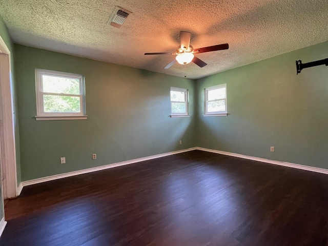 3408 Chaffin Dr, Richland Hills, TX 76118 - unfurnished room with ceiling fan, a textured ceiling, visible vents, and wood finished floors