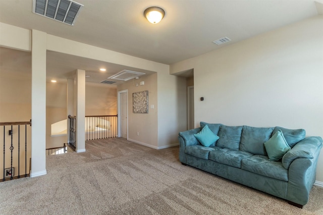 living room featuring visible vents, carpet flooring, attic access, and baseboards