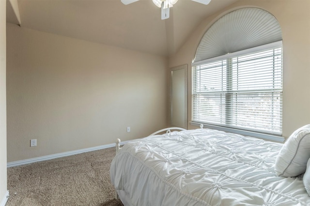 bedroom featuring ceiling fan, baseboards, lofted ceiling, and carpet