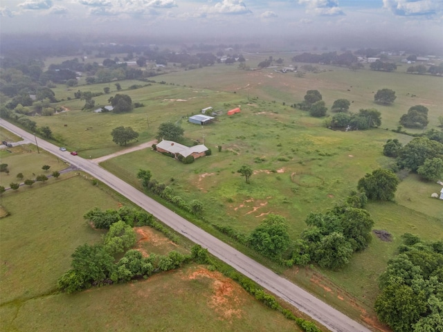 birds eye view of property with a rural view