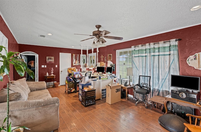 living room featuring hardwood / wood-style flooring, a textured ceiling, visible vents, recessed lighting, and a ceiling fan