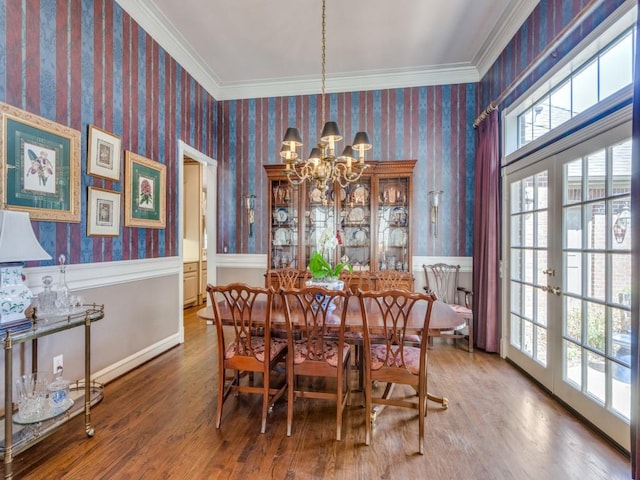 3425 Caleo Ct, Plano, TX 75025 - dining room with wallpapered walls, a chandelier, healthy amount of natural light, wood finished floors, and crown molding