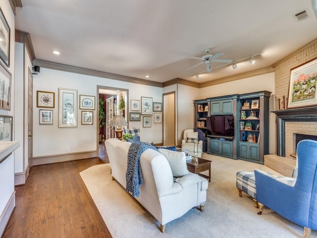 3425 Caleo Ct, Plano, TX 75025 - living area with crown molding, ceiling fan, recessed lighting, light wood-style floors, and baseboards