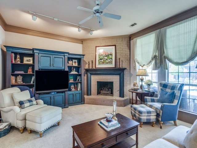 3425 Caleo Ct, Plano, TX 75025 - living area featuring track lighting, light carpet, a brick fireplace, a ceiling fan, and ornamental molding