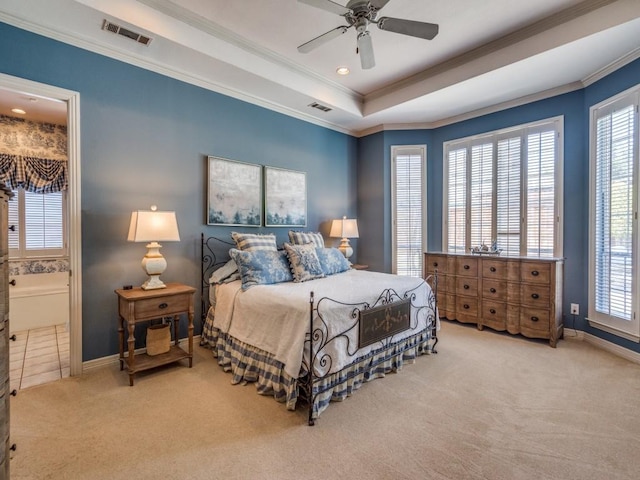3425 Caleo Ct, Plano, TX 75025 - carpeted bedroom featuring crown molding, a raised ceiling, baseboards, a ceiling fan, and ensuite bathroom