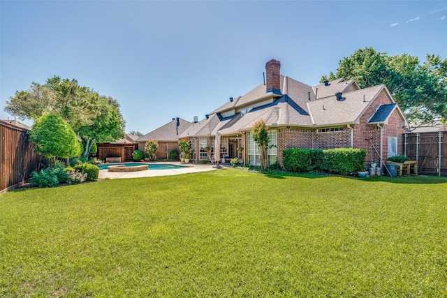 3425 Caleo Ct, Plano, TX 75025 - rear view of house with brick siding, a chimney, roof with shingles, and a pool with connected hot tub