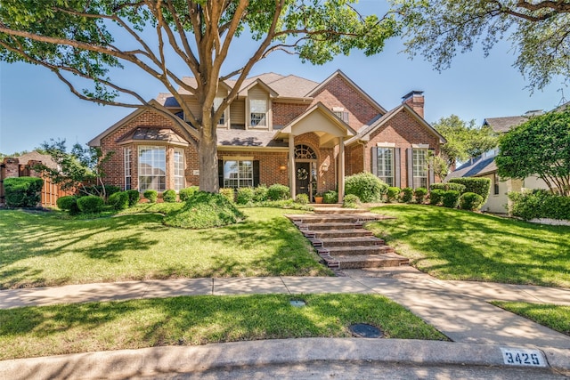 3425 Caleo Ct, Plano, TX 75025 - traditional-style home with brick siding and a front lawn