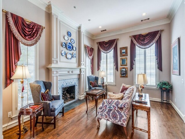 3425 Caleo Ct, Plano, TX 75025 - sitting room featuring plenty of natural light, wood finished floors, a fireplace, crown molding, and baseboards