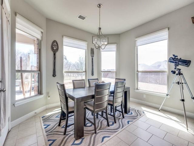 6601 Elderberry Way, Flower Mound, TX 76226 - dining space with a chandelier, healthy amount of natural light, baseboards, and light tile patterned floors