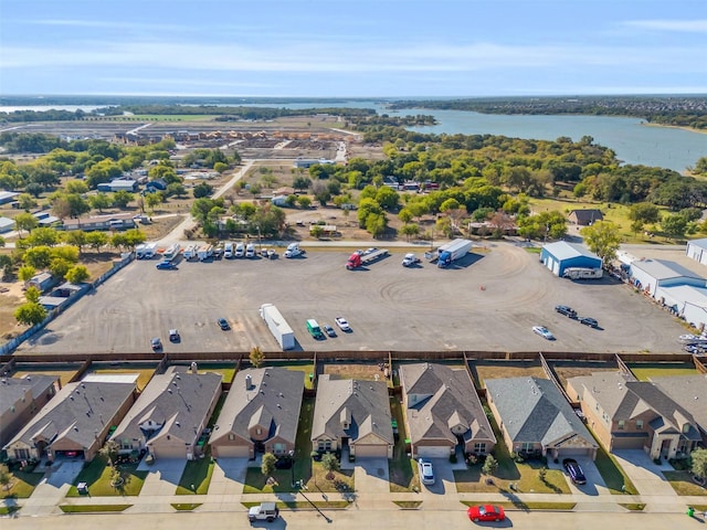 bird's eye view featuring a residential view and a water view