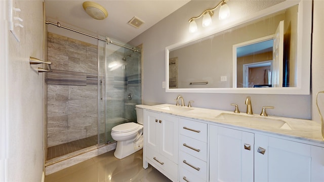 bathroom with a sink, a stall shower, toilet, and visible vents