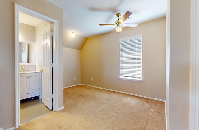 bonus room with baseboards, ceiling fan, lofted ceiling, and light carpet