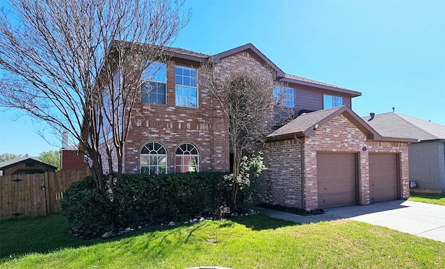 traditional home with an attached garage, brick siding, fence, and a front yard