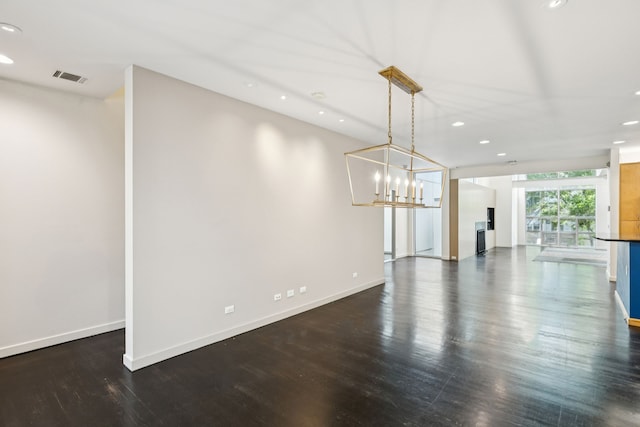 3315 Miro Pl, Dallas, TX 75204 - unfurnished living room featuring recessed lighting, dark wood-style floors, and a chandelier